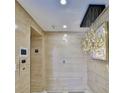 Hallway featuring wood paneling, modern lighting, and apartment number 21 at 3435 Bayshore Blvd # 2100P, Tampa, FL 33629