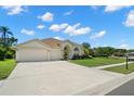 This single-story home features an expansive driveway and well-maintained landscaping at 4769 Stoneview Cir, Oldsmar, FL 34677