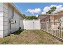 Fenced backyard with gated access at 4816 E 99Th Ave, Tampa, FL 33617