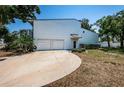 Charming two-story home featuring a double garage, mature trees and a welcoming driveway at 6238 92Nd N Pl # 3201, Pinellas Park, FL 33782