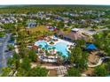 Aerial view of community pool area, showcasing various amenities and recreational spaces at 6534 Trent Creek Dr, Ruskin, FL 33573