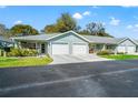 Well-maintained exterior showcasing multiple units, driveways, and green spaces at 6745 Basswood Cir, Zephyrhills, FL 33542
