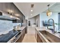 Modern kitchen with stainless steel appliances and elegant marble countertops at 777 N Ashley Dr # 3002, Tampa, FL 33602