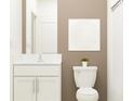 Cozy bathroom featuring a single vanity with a white cabinet and a shower/tub combo at 10274 Gentle Rain Dr, Land O Lakes, FL 34638