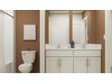 Stylish bathroom featuring a double vanity with white cabinets and a shower/tub combo at 10274 Gentle Rain Dr, Land O Lakes, FL 34638