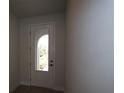 Bright entryway features a front door with glass panel offering great curb appeal at 11834 Mile Marsh Dr, Riverview, FL 33569