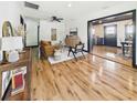 Bright and stylish living room featuring hardwood floors and views into the dining area at 1221 E Emma St, Tampa, FL 33603