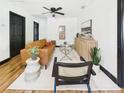 A well-lit living room features hardwood floors and modern furnishings at 1221 E Emma St, Tampa, FL 33603