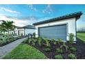 Gorgeous new construction homes with a 2-car garage, well manicured landscaping and a tiled roof at 14256 Eagle Branch Dr, Nokomis, FL 34275