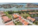 Gorgeous aerial view of a luxury home with lush landscaping and stunning waterfront views at 19 Crescent S Pl, St Petersburg, FL 33711