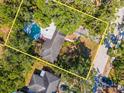 An aerial view of the property showcasing its lush backyard with pool at 4627 W Browning Ave, Tampa, FL 33629