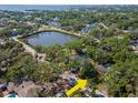 Discover a vibrant community with a serene lake, lush greenery, and stunning waterfront homes at 4627 W Browning Ave, Tampa, FL 33629