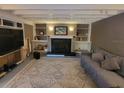 Living room with fireplace, built-in shelves, and neutral tones offers a cozy space at 4627 W Browning Ave, Tampa, FL 33629