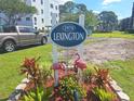 Lexington community sign with flamingo decorations and a well-maintained lawn at 5970 80Th N St # 312, St Petersburg, FL 33709