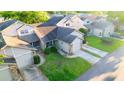 Aerial view of a cozy townhouse in a residential neighborhood with mature trees and well-kept lawns at 6516 Remus Dr, New Port Richey, FL 34653