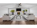 Bright living room with high ceilings, fireplace, and modern furnishings, creating a cozy and inviting atmosphere at 8335 Fountain Ave, Tampa, FL 33615