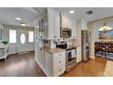 Well-lit kitchen boasting modern appliances, granite countertops, and ample storage space at 907 Golf Island Dr, Apollo Beach, FL 33572