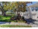 Charming two-story townhouse with well-maintained landscaping and attached one car garage at 9814 Ashburn Lake Dr, Tampa, FL 33610