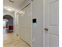 Hallway entrance with tile flooring and an arched opening into a living area at 9814 Ashburn Lake Dr, Tampa, FL 33610