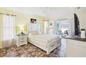 Inviting main bedroom with a spacious layout, neutral tones, and direct access to the outdoor patio area at 10021 Elgin Blvd, Spring Hill, FL 34608