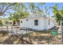 View of a single-story home featuring a fenced yard and light-colored siding at 1540 7Th E Ave, Bradenton, FL 34208