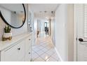 Bright hallway with tile floors, a decorative mirror, and neutral paint at 2413 Bayshore Blvd # 801, Tampa, FL 33629