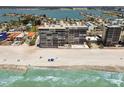 Stunning aerial view of the beachfront condo and the surrounding coastal community at 15462 Gulf Blvd # 504, Madeira Beach, FL 33708