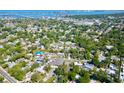 An aerial view showcases the property's location amidst lush greenery and close proximity to the city and waterfront at 2501 Crescent Dr, Largo, FL 33770