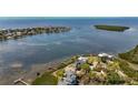 Panoramic aerial view showcasing the waterfront property, surrounding coastline, and neighborhood at 404 Hillsborough St, Palm Harbor, FL 34683