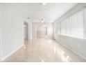 Bright living room with neutral walls, tiled floors, and an open floor plan at 4120 Marine Pkwy, New Port Richey, FL 34652