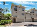 Charming multi-story townhome with attached garages and a well-manicured landscape at 501 Knights Run Ave # 5101, Tampa, FL 33602