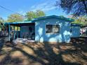 Cozy backyard with covered patio, perfect for outdoor dining and entertaining at 5220 72Nd N St, St Petersburg, FL 33709