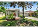 Charming single-Gathering home featuring a well-maintained lawn and mature landscaping at 719 Straw Lake Dr, Brandon, FL 33510