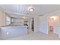 Modern kitchen with stainless steel appliances, granite countertops, and grey cabinets at 905 W Ball St, Plant City, FL 33563