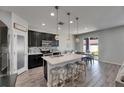 Modern kitchen featuring granite countertops, pendant lighting, and stainless steel appliances at 12123 Ledbury Commons Dr, Gibsonton, FL 33534