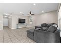 Comfortable living area with tile flooring, TV and large sectional couch at 212 28Th S St, St Petersburg, FL 33712