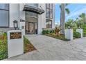 Building entrance with landscaped accents, modern architectural details, and clear signage at 226 5Th N Ave # 605, St Petersburg, FL 33701