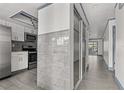 Updated kitchen featuring stainless steel appliances, tile backsplash and flooring at 2275 62Nd N Ave # 5202, St Petersburg, FL 33702