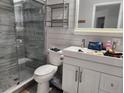 Bathroom featuring a glass-enclosed shower and a contemporary vanity with a sink at 2830 W Bay Haven Dr, Tampa, FL 33611