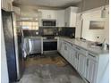 Updated kitchen with stainless steel appliances and modern countertops; renovation in progress at 2830 W Bay Haven Dr, Tampa, FL 33611