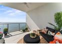 Furnished balcony featuring outdoor seating, a coffee table, and water views at 2910 W Barcelona St # 1902, Tampa, FL 33629