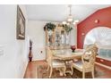 Traditional dining room with vaulted ceiling, decor, and natural light at 29737 Fog Hollow Dr, Wesley Chapel, FL 33543