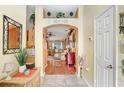 View of the foyer leading into the kitchen and living room at 29737 Fog Hollow Dr, Wesley Chapel, FL 33543