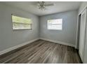 Neutral bedroom with plenty of natural light and gray floors at 3599 66Th N Way, St Petersburg, FL 33710