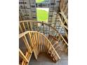 Image displays a spiral staircase under construction with wooden frames, soon leading to more rooms with natural lighting at 4321 S Renellie Dr, Tampa, FL 33611