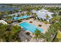 Beautiful community pool area with a separate lap pool, splash zone, and plenty of lounge seating at 6337 Shore Vista Pl, Apollo Beach, FL 33572