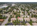 Wide aerial view of a residential neighborhood showcasing townhomes and tree-lined streets at 7826 66Th N Way, Pinellas Park, FL 33781