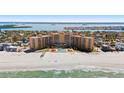 Aerial view of the beachfront highrise condo with pool and ocean access at 880 Mandalay Ave # C908, Clearwater Beach, FL 33767