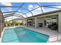 Beautiful screened-in pool and patio area, perfect for entertaining and relaxation, with outdoor dining and lounge at 9921 Pier Point Ter, Parrish, FL 34219