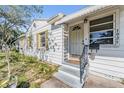 Inviting front entrance with updated door and new steps with decorative railing at 1025 W Berry Ave, Tampa, FL 33603